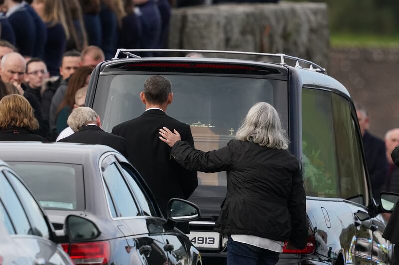 Mourners comfort each other as they arrive for the funeral mass of James Monaghan and and his mother Catherine O'Donnell at St Michael's Church, Creeslough. Photograph: Brian Lawless/PA Wire