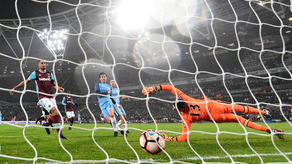 David Silva slots Manchester City’s third in their FA Cup third round rout of West Ham. Photograph: Reuters/Toby Melville