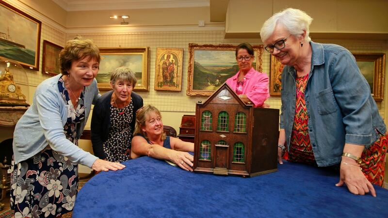 Volunteers from the children’s charity. Tara’s Palace, from left, Patricia Woods, Roslyn Nicholson, Jenny Johnston, Anne Lawless and Mary Moore with the doll’s house. Photograph: Nick Bradshaw