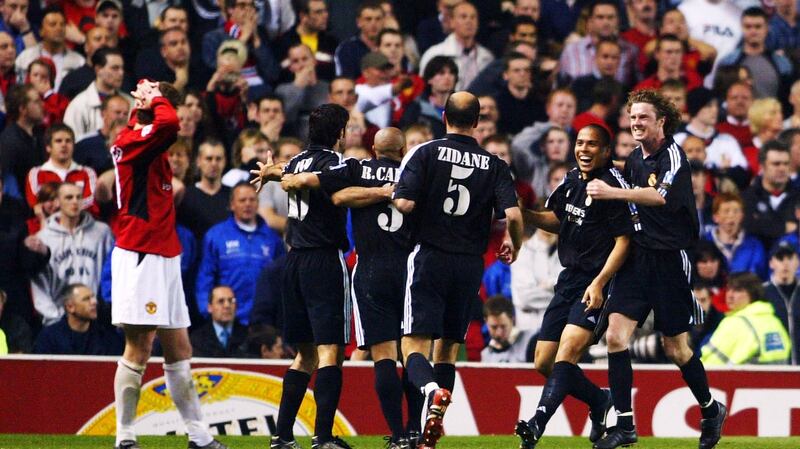 A dejected Ole Gunnar Solskjær reacts after Real Madrid’s Ronaldo celebrates after scoring the third goal during the Champions League quarter-final, second leg against Manchester United at Old Trafford in 2003. Photograph: Laurence Griffiths/Getty Images