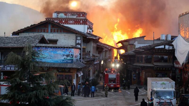 Firefighters battle a blaze at the Dukezong Ancient Town in Shangri-la county, Yunnan province. Photograph: Reuters