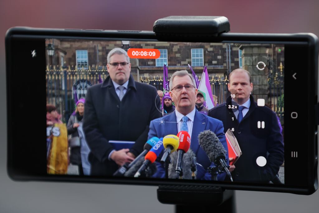 A phone records deputy leader of the DUP Gavin Robinson, DUP leader Sir Jeffrey Donaldson and DUP MLA Gordon Lyons speaking to media outside Hillsborough Castle after talks between Northern Ireland Secretary Chris Heaton-Harris and the main political parties. Photograph: Liam McBurney/PA Wire