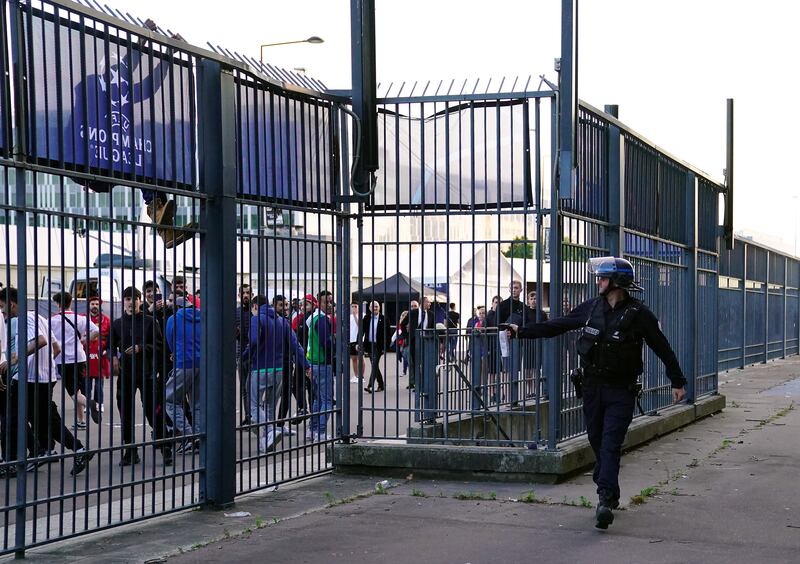 Police use pepper spray against fans outside the ground. Photograph: Adam Davy/PA