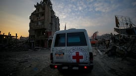 Hamas armed wing says it will hand over body of hostage as airstrikes continue in Gaza