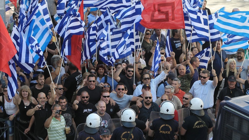 Supporters of far-right Golden Dawn party outside the appeals court in Athens, Greece in 2014. The neo-fascist group recorded 500,000 votes in last September’s general election, seven per cent of the poll, returning 18 MPs. Photograph: Simela Pantzartzi/EPA