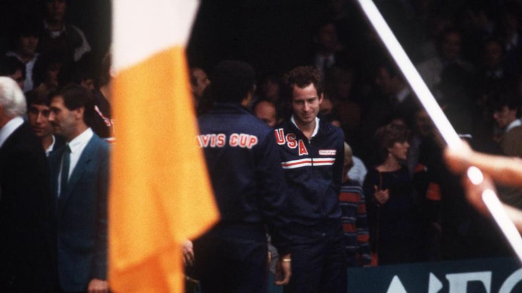 USA player John McEnroe and non-playing captain Arthur Ashe prepare to take on Ireland at the RDS in the Davis Cup World Group game in 1983. Photograph: Billy Stickland/Inpho.