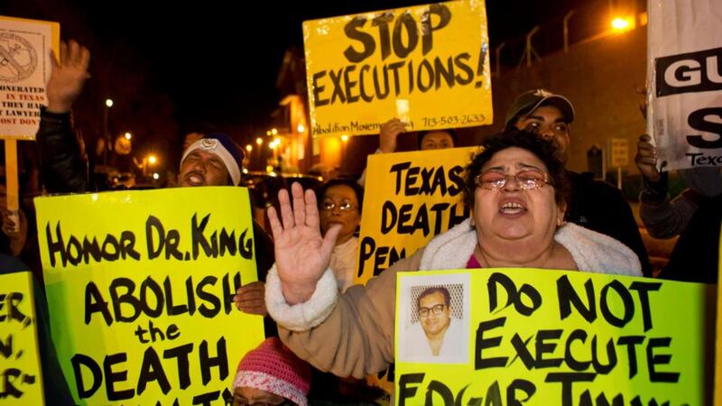 Protestors sing and chant outside the “Walls” prison unit where Edgar Tamayo was executed in Huntsville, Texas. Photograph: Richard Carson/Reuters