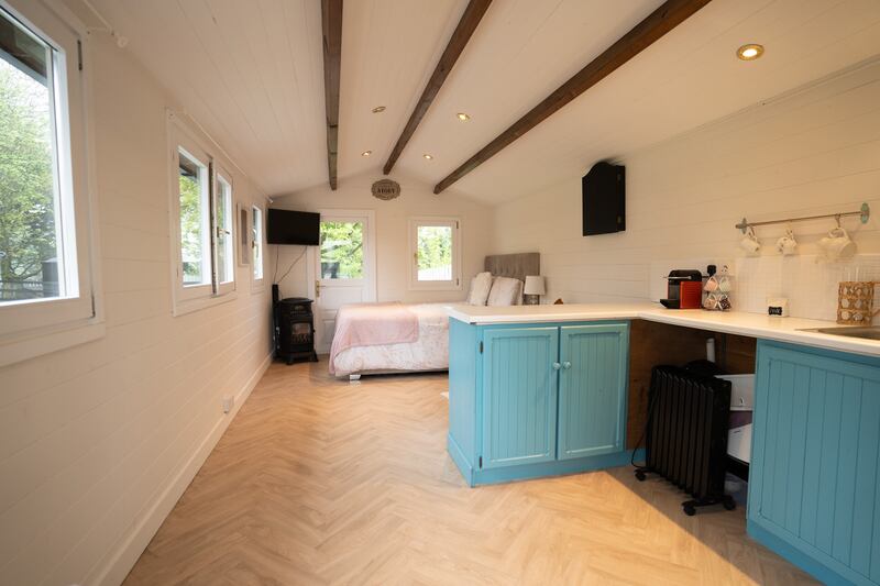 Cabin with kitchenette. Currently used as a guest room, it would make a great den, playroom, or possibly a home office.