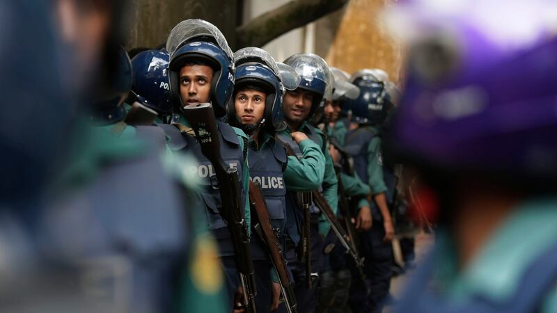 Bangladeshi policemen on  guard after cordoning off a  building where suspected militants were hiding in Dhaka, Bangladesh, Saturday, December 24th, 2016. Photograph: AP Photo