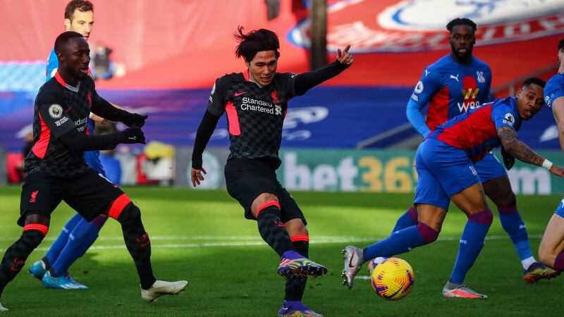 Minamino opens the scoring. Photo: Clive Rose/EPA