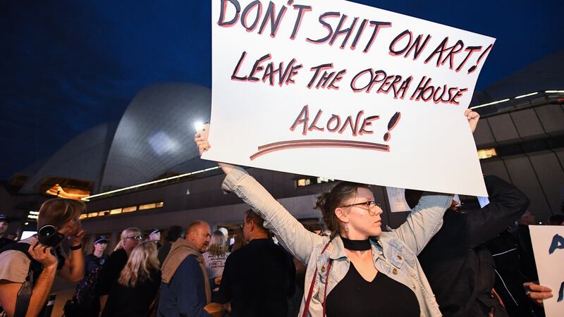 Demonstrators protest against the decision to project an ad for NSW Racing’s multi million dollar race, The Everest, onto the sails of the Sydney Opera House. Photograph: EPA