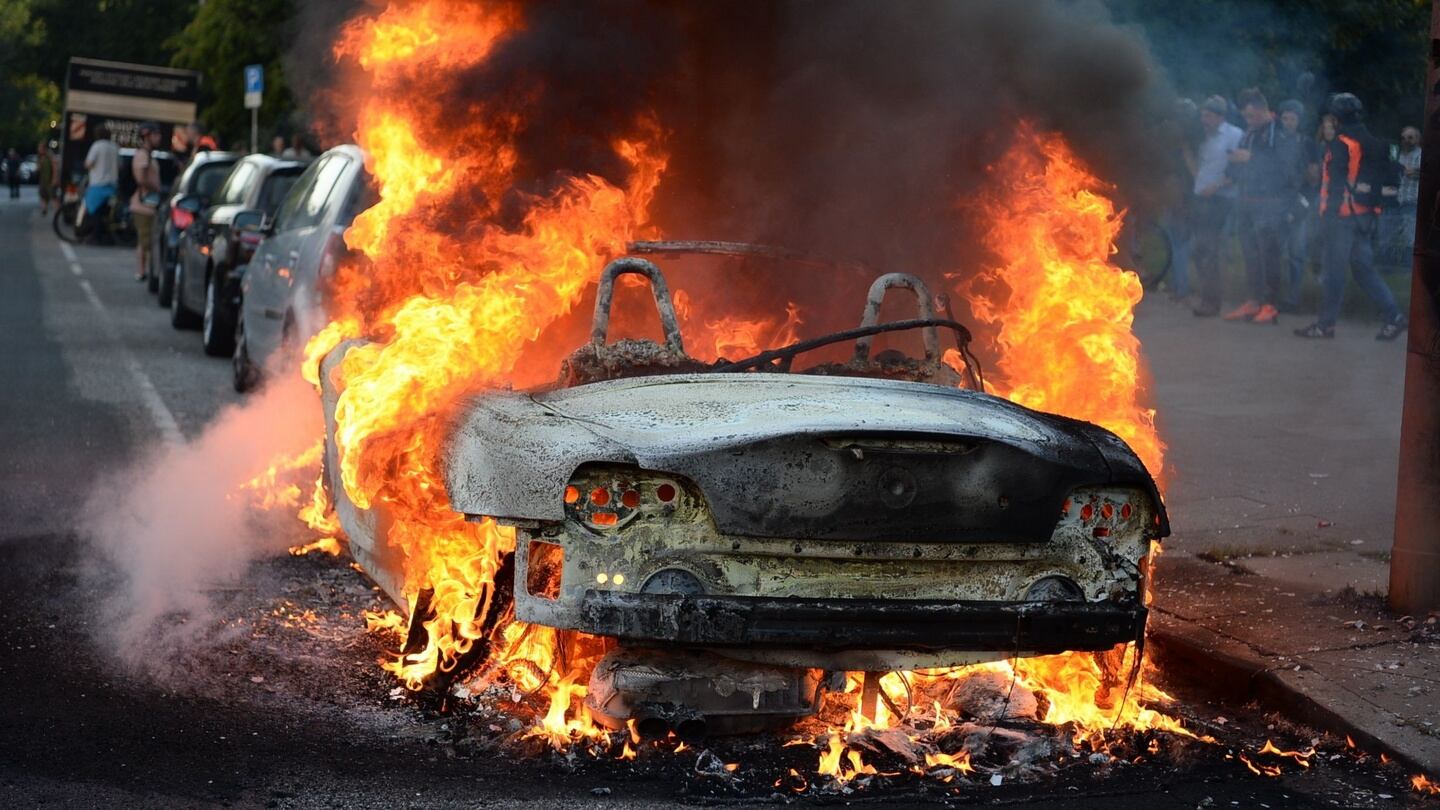 A car is set alight during the “Welcome to Hell” rally against the G20 summit in Hamburg, northern Germany. Photograph: Christophe Gateau/AFP/Getty Images