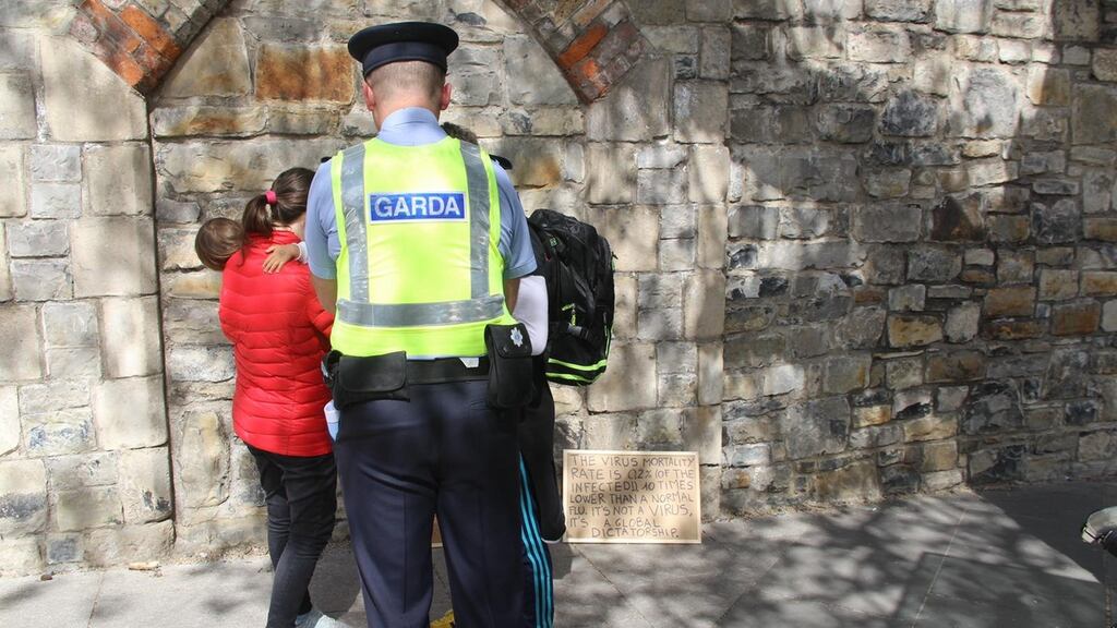 Gardaí speaking to would-be protesters near Dublin’s Phoenix Park on Saturday. Photograph: Ronan McGreevy