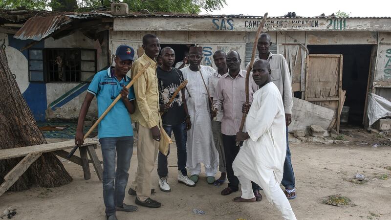 Members of Sector 10 of the Nigerian vigilante group Civilian Joint Task Force  with weapons they use when accompanying the military.