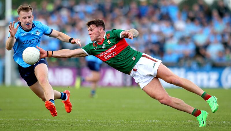 Dublin’s Seán Bugler and Mayo's Jordan Flynn in action during the championship clash at Dr Hyde Park, Roscommon. Photograph: Ryan Byrne/Inpho