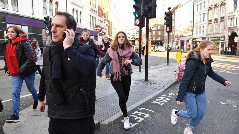 People running away from Borough Market in London after police ask them to leave the area. Photograph: Dominic Lipinski/PA Wire