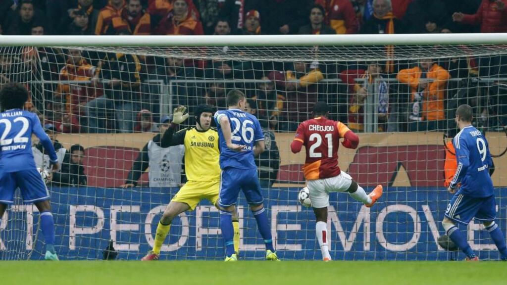 Galatasaray manager Roberto Mancini tries to get his message across as Wesley Sneijder takes a throw-in against Chelsea. Photograph: Tolga Bozoglu/EPA