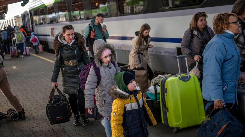 Ukrainian refugees board a train en route to Warsaw at the railway station in Przemysl, near the Polish-Ukrainian border. Photograph: Angelos Tzortzinis/AFP via Getty Images