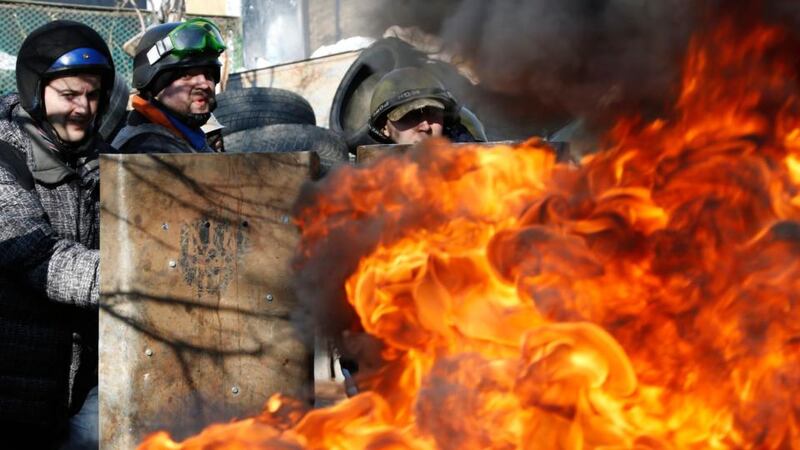 Terror reigns: anti-government protesters guard barricades near Independence Square in Kiev. Photograph: Yannis Behrakis/Reuters