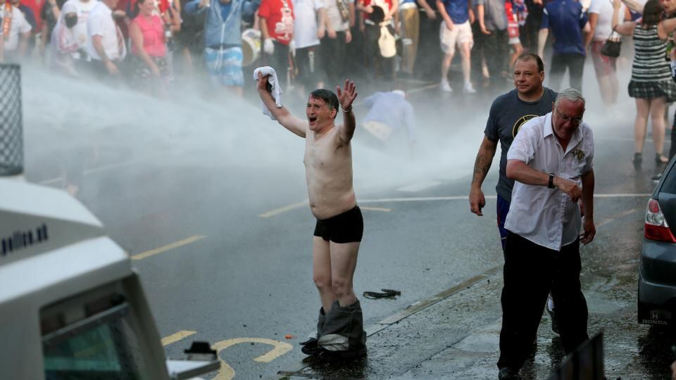 Loyalists confront police in north Belfaston Friday, the Twelfth of July. Photograph: Julien Behal/PA Wire