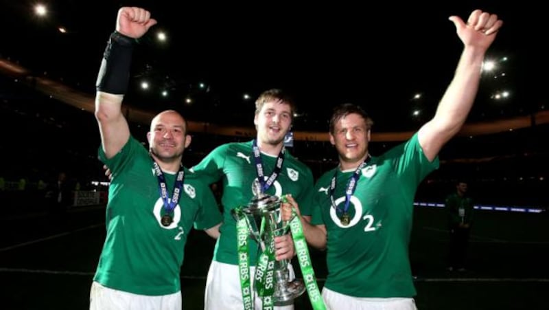 Ireland’s Rory Best, Iain Henderson and Chris Henry celebrate in Stade de Frances. Photograph: Dan Sheridan/Inpho
