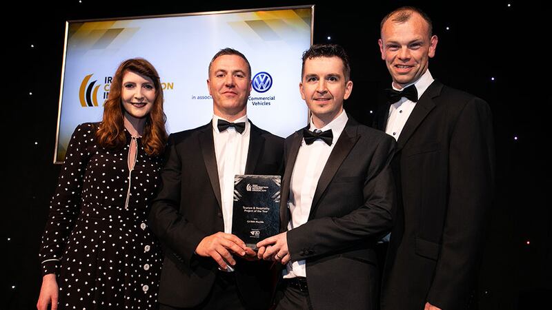 Michael Byrne, Managing Director, 3D Personnel presents the Tourism & Hospitality of the Year award to the McCabe Architects team.