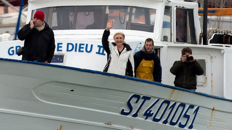 French presidential candidate Marine Le Pen meets fishermen in the harbour of Le Grau-du-Roi. Photograph: Bertrand Langlois/AFP/Getty Images