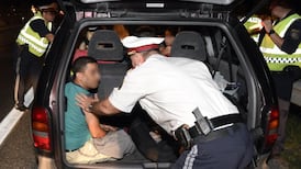 Austria says 200 refugees, five smugglers stopped at border