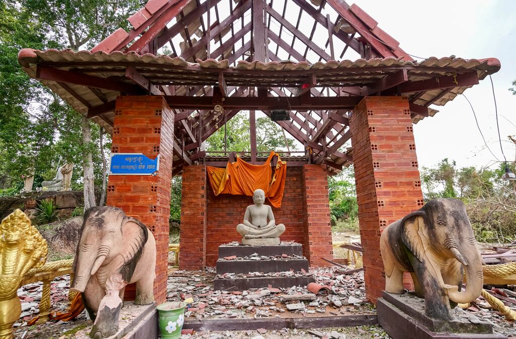 A pagoda damaged by Thai artillery in Oddar Meanchey province on Friday. Thailand's acting prime minister Phumtham Wechayachai warned that cross-border clashes with Cambodia 'could develop into war'. Photograph: AFP