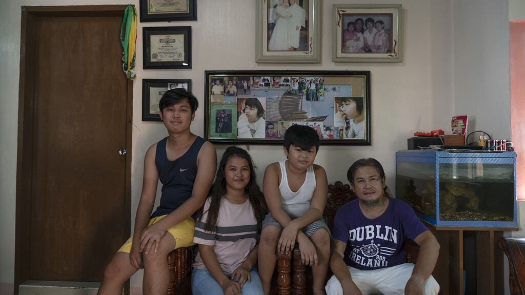 Alma’s family at their home in The Philippines. Photographs: Kimberly dela Cruz