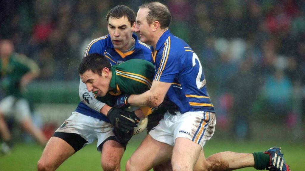 Wicklow’s Paddy Dalton and Mark Staines with Damien Carroll of Meath in Baltinglass. Photograph: Inpho