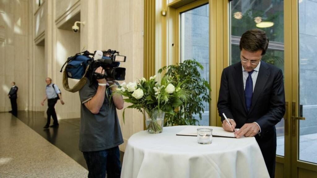 Dutch prime minister Mark Rutte signs a condolence register at the ministry of safety and justice in The Hague for relatives and friends of the victims of Malaysian Airlines flight MH17. Photograph: Bart Maat/EPA