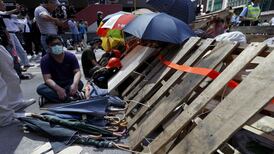 Hong Kong activists recapture protest zone after skirmishes