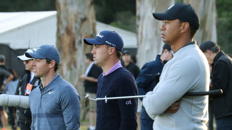 Rory McIlroy, Justin Thomas and Tiger Woods wait on the 10th green during the first round at Riviera Country Club. Photograph: PA