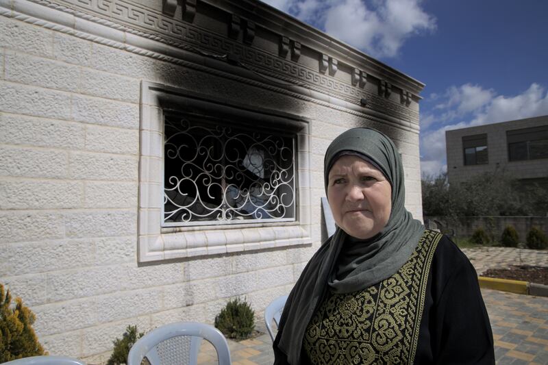 Jamila Dumeidi outside her home in Huwara which was attacked by Israeli settlers on February 26th. Photograph: Hannah McCarthy
