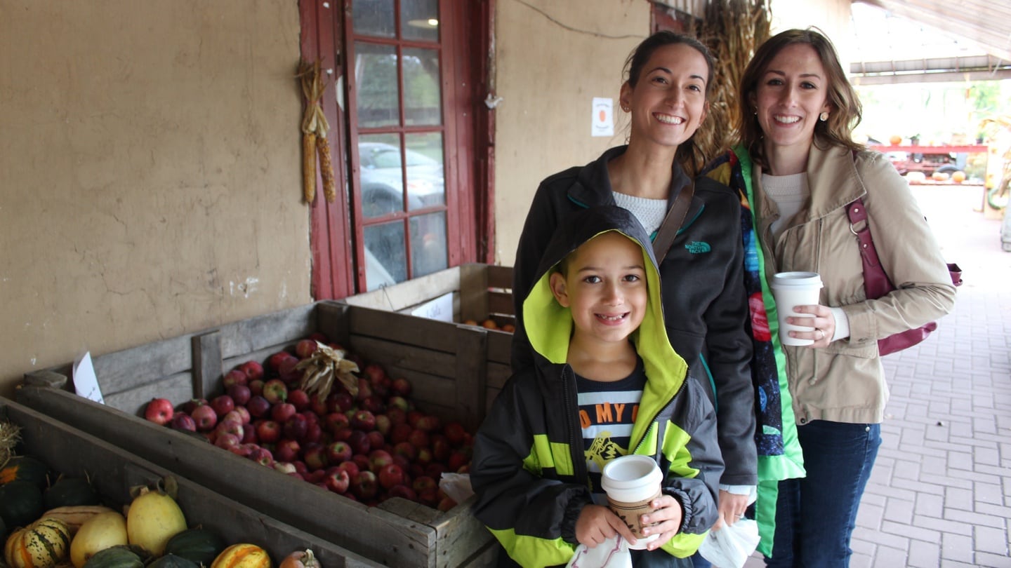 Misty Tanksley (left) with her son Ian and friend Laura Maffin at Tabora Farm & Orchard in Bucks County, Pennsylvania, a suburb county of Philadelphia. Photograph: Simon Carswell