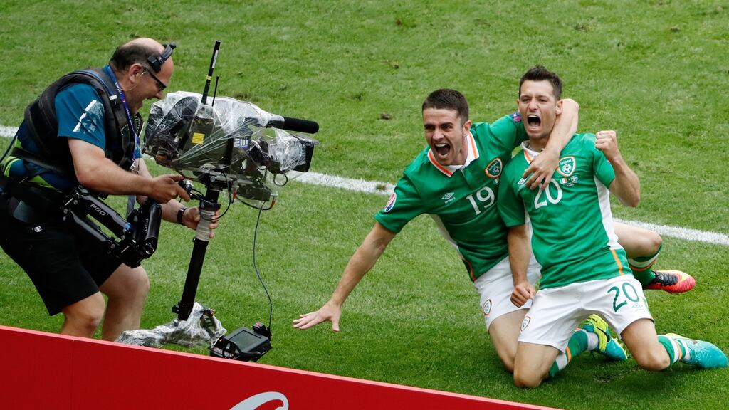 Republic of Ireland’s Wes Hoolahan celebrates with Robbie Brady after scoring the opening goal at the Stade de France. Photograph: Charles Platiau/Reuters