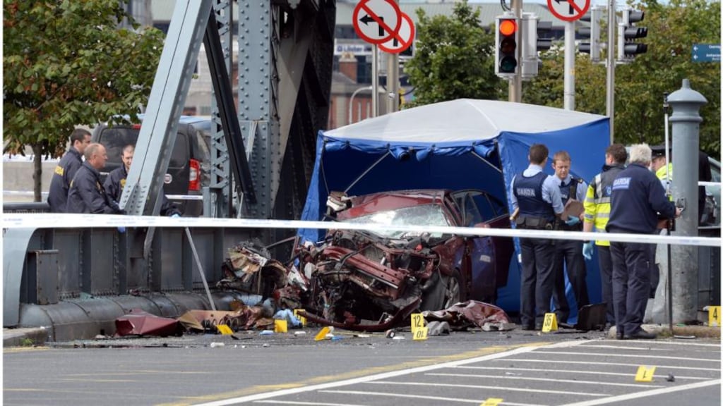 Gardai on the scene of this morning’s fatal crash at the North Wall in Dublin city centre. Photograph: Brenda Fitzsimons/The Irish Times