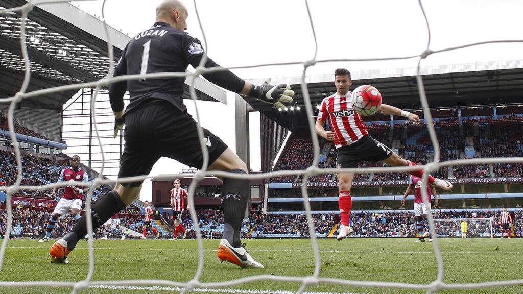 Southampton’s Shane Long scores their first goal at Villa Park. Photograph: Jason Cairnduff/Reuters