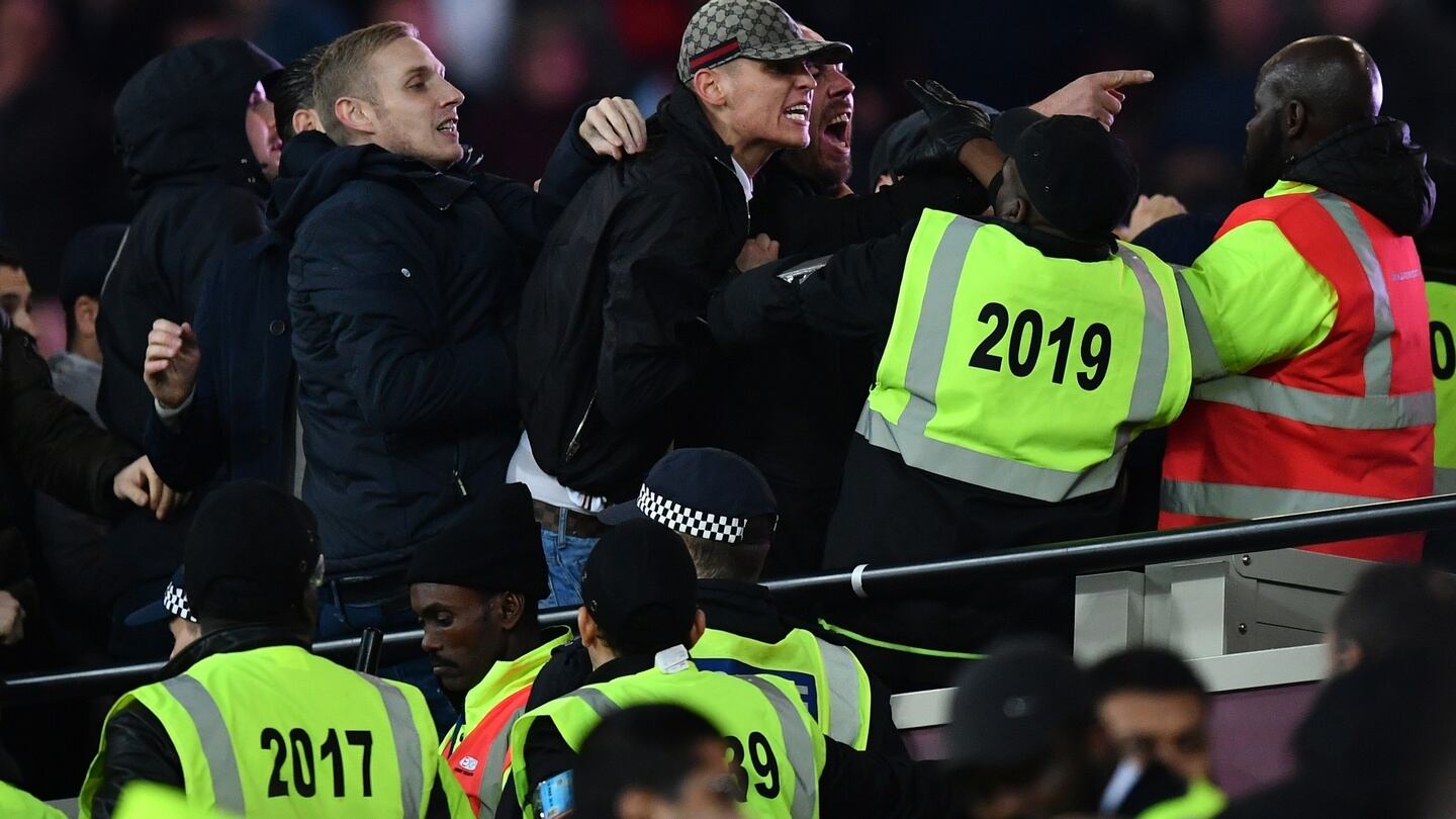 Fans clash with stewards during the EFL Cup fourth round match between West Ham United and Chelsea at The London Stadium. Photo: Dan Mullan/Getty Images