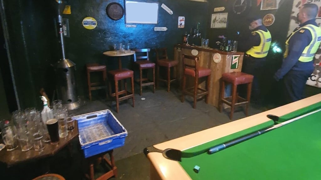 Gardaí searched a suspected shebeen near Athy in Co Kildare on Friday and found a bar, stools, tables and chairs, a 70-inch flat screen TV and a pool table. Image: Gardainfo/Twitter