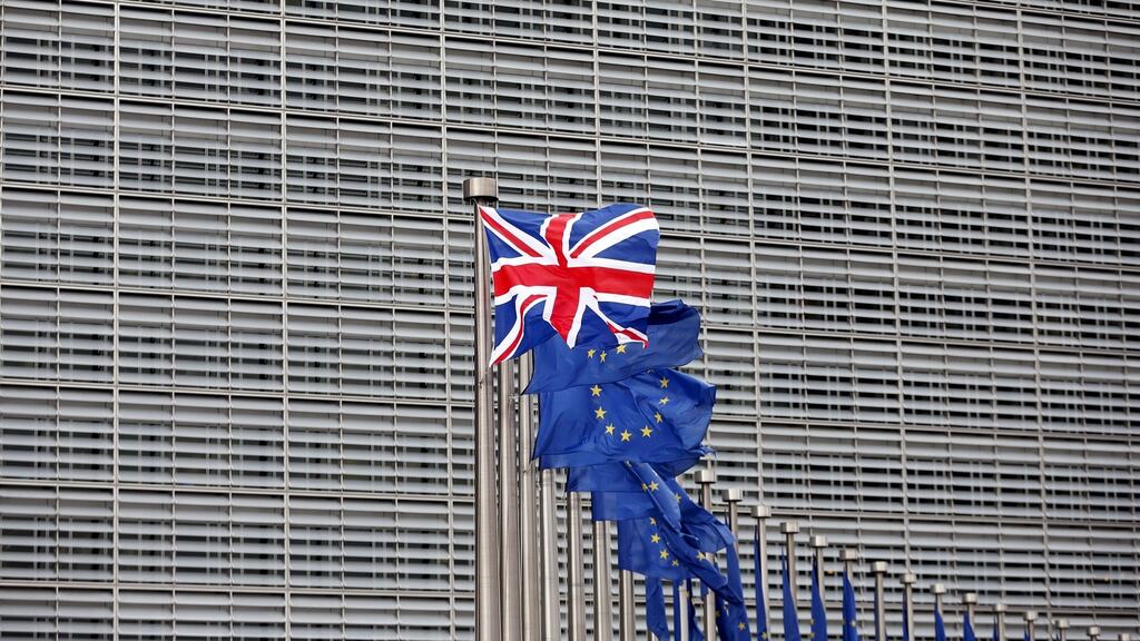 A Union Jack flag flutters next to European Union flags  in Brussels, Belgium. Photograph: Francois Lenoir/Reuters
