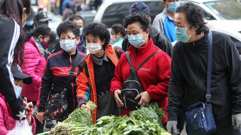 Residents wearing face masks buy vegetables at a market in Shenyang in China’s northeastern Liaoning province on April 17th, 2020. Photograph: STR/AFP via Getty Images.