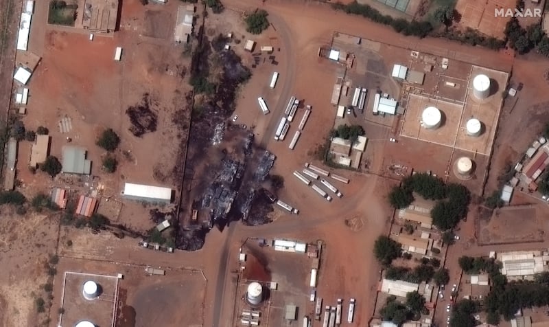 A satellite image shows destroyed fuel trucks at a fuel depot in Khartoum, Sudan. Photograph: Maxar Technologies via The New York Times