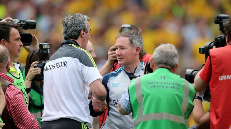 Jim McGuinness and Jim Gavin after Dublin’s shock defeat in 2014. Photograph: Inpho
