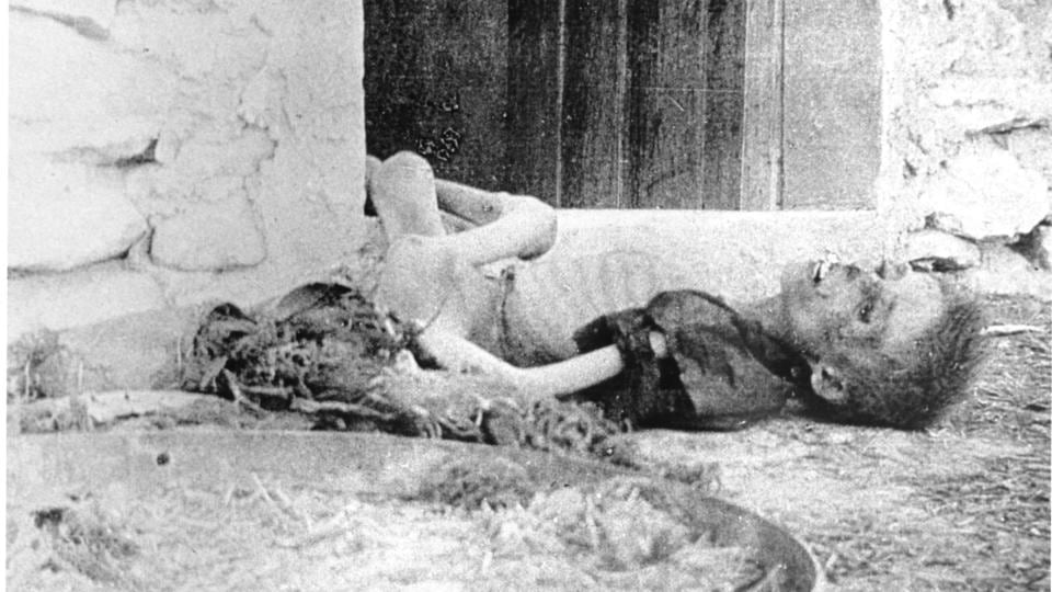 An emaciated Armenian boy lies dead on a doorstep. Photograph: Armin Wegner / Armenian National Institute, courtesy of Sybil Stevens