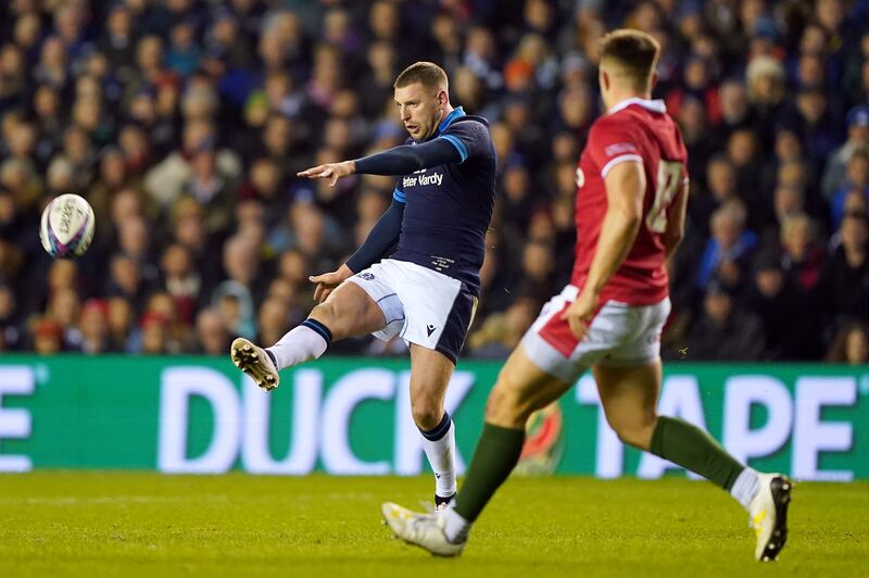 Scotland's Finn Russell kicks the ball against Wales. Photograph: Andrew Milligan/PA Wire