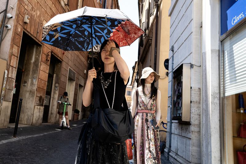 Tourists in Rome, where a red heatwave alert has been issued, on Monday. Photograph: Andreas Solaro/AFP/Getty