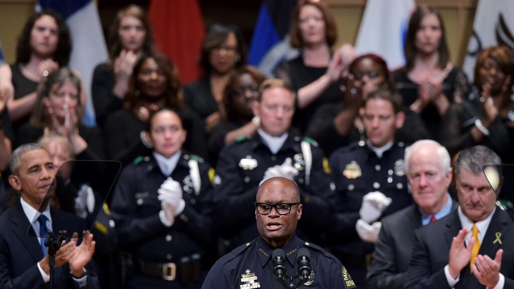 Dallas police chief David Brown speaks during a memorial service for the victims of the  police shooting in Dallas, Texas. When asked, as an African-American police officer  how to bridge the divide between the two, the self-effacing Brown turned to humour. Photograph:  Mandel Ngan/AFP/Getty Images