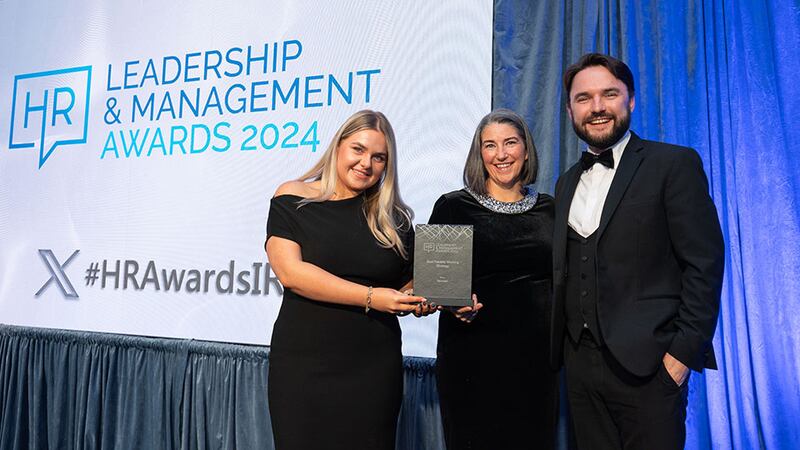 Lily Rowntree, entries lead, presents the best flexible working strategy award to Maria Towey, Spunout